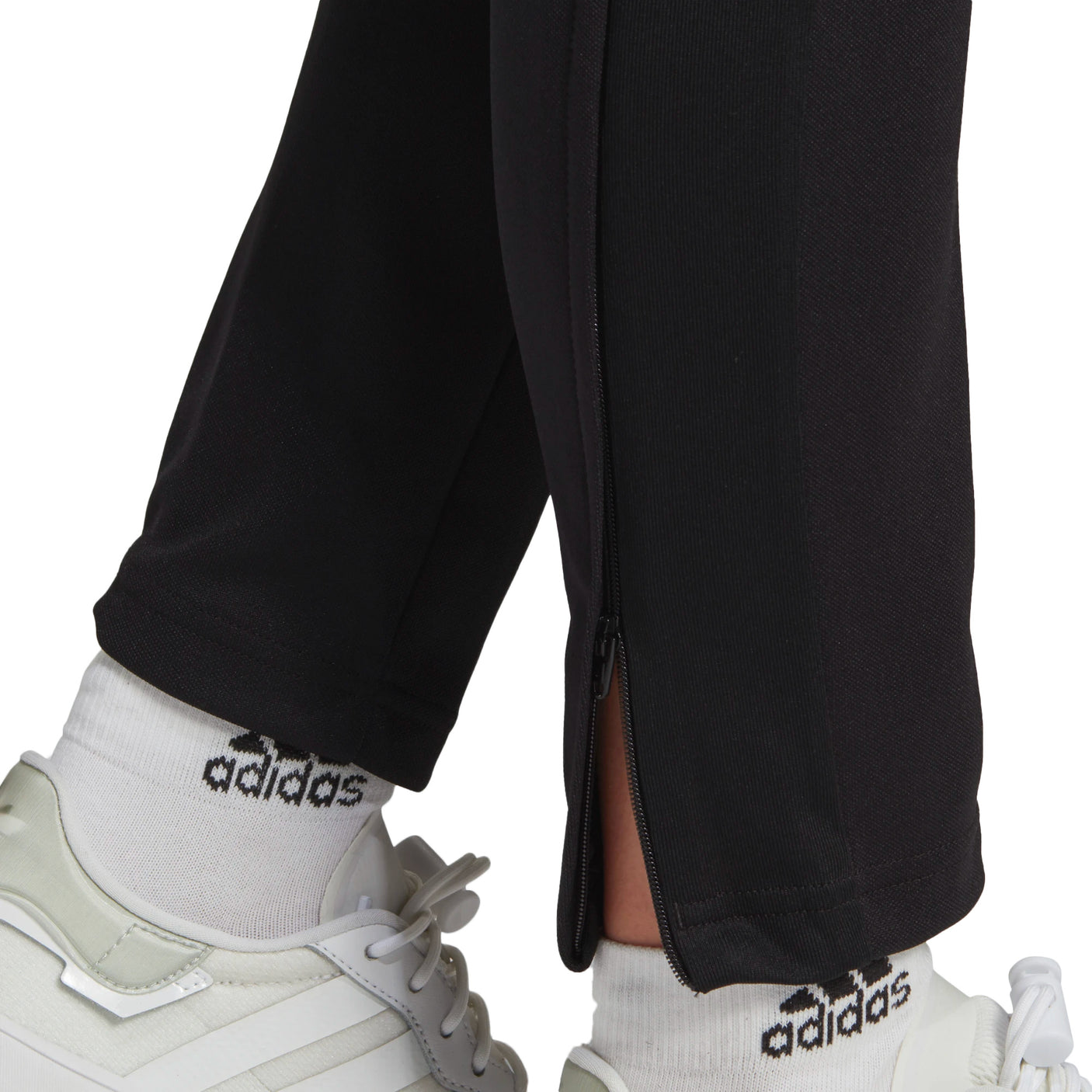 https://aztecasoccer.com/cdn/shop/products/adidas-Womens-Tiro-21-Track-Pants-Black-White-Model-Zipper-Zoomed.jpg?v=1615588935&width=1406